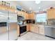 Kitchen with stainless steel appliances and granite counters at 2849 Leicester Ter, The Villages, FL 32162