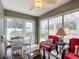 Sunroom with outdoor view and seating area at 2849 Leicester Ter, The Villages, FL 32162