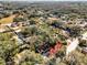 Aerial view of a neighborhood surrounded by lush greenery at 307 Park Ave, Groveland, FL 34736