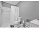 Clean bathroom with white tile shower/tub combo at 307 Park Ave, Groveland, FL 34736