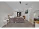 Bedroom features barn door, ceiling fan and closet at 307 Park Ave, Groveland, FL 34736