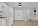 View of the kitchen with a breakfast nook and white appliances at 307 Park Ave, Groveland, FL 34736