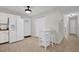 View of the kitchen with a breakfast nook and white appliances at 307 Park Ave, Groveland, FL 34736