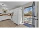 Bright kitchen with white cabinets, butcher block countertops, and stainless appliances at 307 Park Ave, Groveland, FL 34736