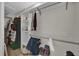 Well-organized walk-in closet with shelving and hanging space for optimal storage at 307 Park Ave, Groveland, FL 34736