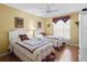 Cozy bedroom with twin beds, a ceiling fan, and a window providing natural light at 3183 Hatch Ln, The Villages, FL 32162