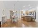 Comfortable dining area adjacent to kitchen and patio, illuminated by chandelier at 3183 Hatch Ln, The Villages, FL 32162