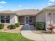 Inviting front porch with decorative screen door and cozy seating area at 3183 Hatch Ln, The Villages, FL 32162