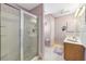 Well-lit bathroom featuring a walk-in shower, vanity, and modern fixtures at 3319 Thorncrest Dr, The Villages, FL 32162