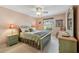 Serene bedroom with a comfortable bed, soft lighting, and charming decor at 3319 Thorncrest Dr, The Villages, FL 32162