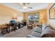 Comfortable living room with a neutral color scheme, plush carpet, and natural light at 3319 Thorncrest Dr, The Villages, FL 32162