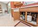 Functional kitchen space under the sink with a water filtration system and storage at 3319 Thorncrest Dr, The Villages, FL 32162