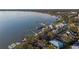 Scenic aerial view of a lakefront community with waterfront homes and boat docks on the calm water at 343 N Mcdonald St # 203, Mount Dora, FL 32757