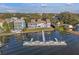 An aerial view of a lakefront home featuring a private dock offering direct lake access at 343 N Mcdonald St # 203, Mount Dora, FL 32757