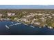 An aerial shot showcases a lakefront home with direct access to the water and docks nearby at 343 N Mcdonald St # 203, Mount Dora, FL 32757