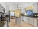 Well-lit kitchen featuring stainless steel appliances and a breakfast nook at 343 N Mcdonald St # 203, Mount Dora, FL 32757