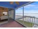 Screened-in patio with a view of the water and a dock at 343 N Mcdonald St # 203, Mount Dora, FL 32757