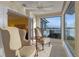 Bright sunroom featuring floor-to-ceiling windows with views of the water at 343 N Mcdonald St # 203, Mount Dora, FL 32757