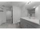 Bathroom boasts a modern vanity, sink, and tiled floors at 3480 Soho St # 206, Orlando, FL 32835