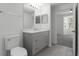 Bright bathroom with a gray vanity, sink, and tiled floors at 3480 Soho St # 206, Orlando, FL 32835