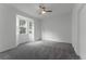 Bedroom featuring bay window, neutral walls, and plush carpeting at 3480 Soho St # 206, Orlando, FL 32835