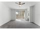 A spacious living room with sliding glass doors leading to a balcony at 3480 Soho St # 206, Orlando, FL 32835