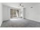 Living room features natural light from a sliding glass door to a balcony at 3480 Soho St # 206, Orlando, FL 32835