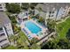 Aerial view of the community pool with sundeck and lounge chairs, perfect for relaxation and recreation at 3480 Soho St # 206, Orlando, FL 32835