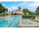 Large community pool with spa and multiple lounge areas with a sunny view at 3480 Soho St # 206, Orlando, FL 32835