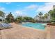 Resort-style swimming pool and lounge chairs for residents to enjoy on a sunny day at 3480 Soho St # 206, Orlando, FL 32835