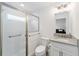 Clean bathroom with walk-in shower, toilet, and vanity with granite countertop at 3769 Causey Ct, The Villages, FL 32163