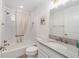 Simple bathroom with bathtub, toilet, and vanity at 3769 Causey Ct, The Villages, FL 32163