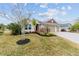 House front with landscaping and two-car garage at 3769 Causey Ct, The Villages, FL 32163