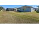 Spacious backyard with grassy lawn at 4127 Arlington Ridge Blvd, Leesburg, FL 34748