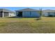 Large backyard with grassy lawn at 4127 Arlington Ridge Blvd, Leesburg, FL 34748