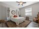 Comfortable bedroom with a queen bed and a built-in wall unit at 4127 Arlington Ridge Blvd, Leesburg, FL 34748