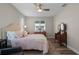 Spacious bedroom with a queen-size bed and ample natural light at 4127 Arlington Ridge Blvd, Leesburg, FL 34748