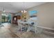 Dining area with hardwood floors, chandelier and view to patio at 4127 Arlington Ridge Blvd, Leesburg, FL 34748