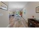 Bright dining area with hardwood floors and view to living room at 4127 Arlington Ridge Blvd, Leesburg, FL 34748