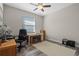 Home office with a desk, chair, and window at 4127 Arlington Ridge Blvd, Leesburg, FL 34748