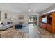 Living room with patio access and built-in shelving at 4127 Arlington Ridge Blvd, Leesburg, FL 34748