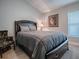 This bedroom offers neutral carpet and a comfortable queen size bed at 4774 Cosentino Ct, The Villages, FL 32163