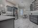 Stylish kitchen featuring stainless steel appliances and gray cabinetry at 4774 Cosentino Ct, The Villages, FL 32163