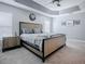 Main bedroom featuring neutral colored walls and decor and recessed ceiling at 4774 Cosentino Ct, The Villages, FL 32163