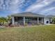 This home features a screened-in lanai with outdoor kitchen, offering a perfect space for relaxation and entertainment at 4774 Cosentino Ct, The Villages, FL 32163