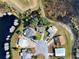 Aerial view of a neighborhood showcases the area's beautiful scenery and well-maintained homes at 5338 Tigers Tail, Leesburg, FL 34748