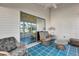 Sunroom with wicker furniture and glass doors to backyard at 5513 Shriver St, Leesburg, FL 34748