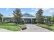 The neighborhood clubhouse has charming landscaping and an inviting entrance at 752 Chacall Loop, Mount Dora, FL 32757