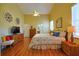 Spacious main bedroom with wood floors, high ceilings, and a comfortable aesthetic at 752 Chacall Loop, Mount Dora, FL 32757