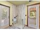 Shower room with tiled walls, and dual walk-out access at 775 Abeble Rd, Lady Lake, FL 32159